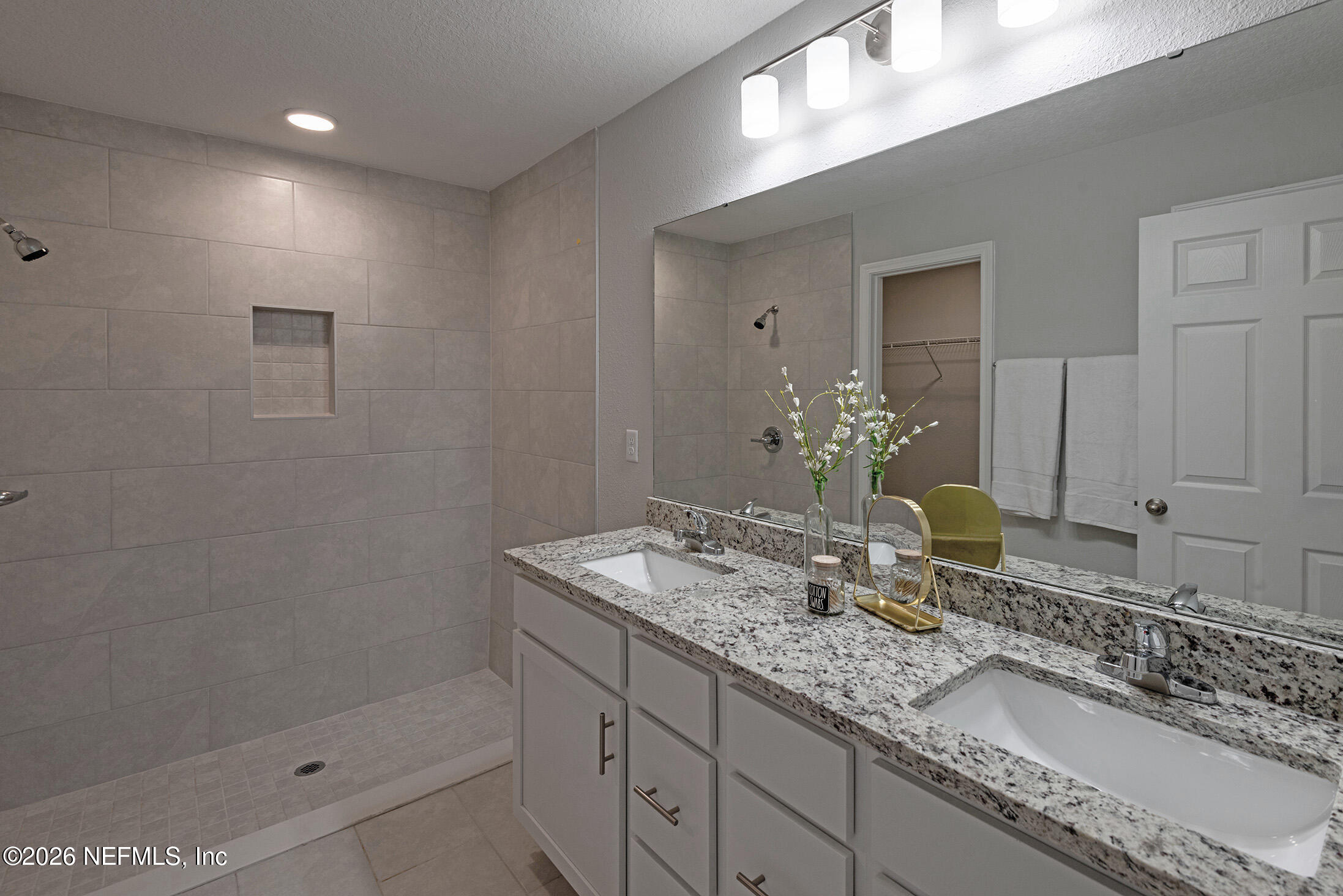13748 Coman Road Jacksonville, FL 32218 - Photo 20 of 34 a bathroom with a granite countertop sink a mirror and shower