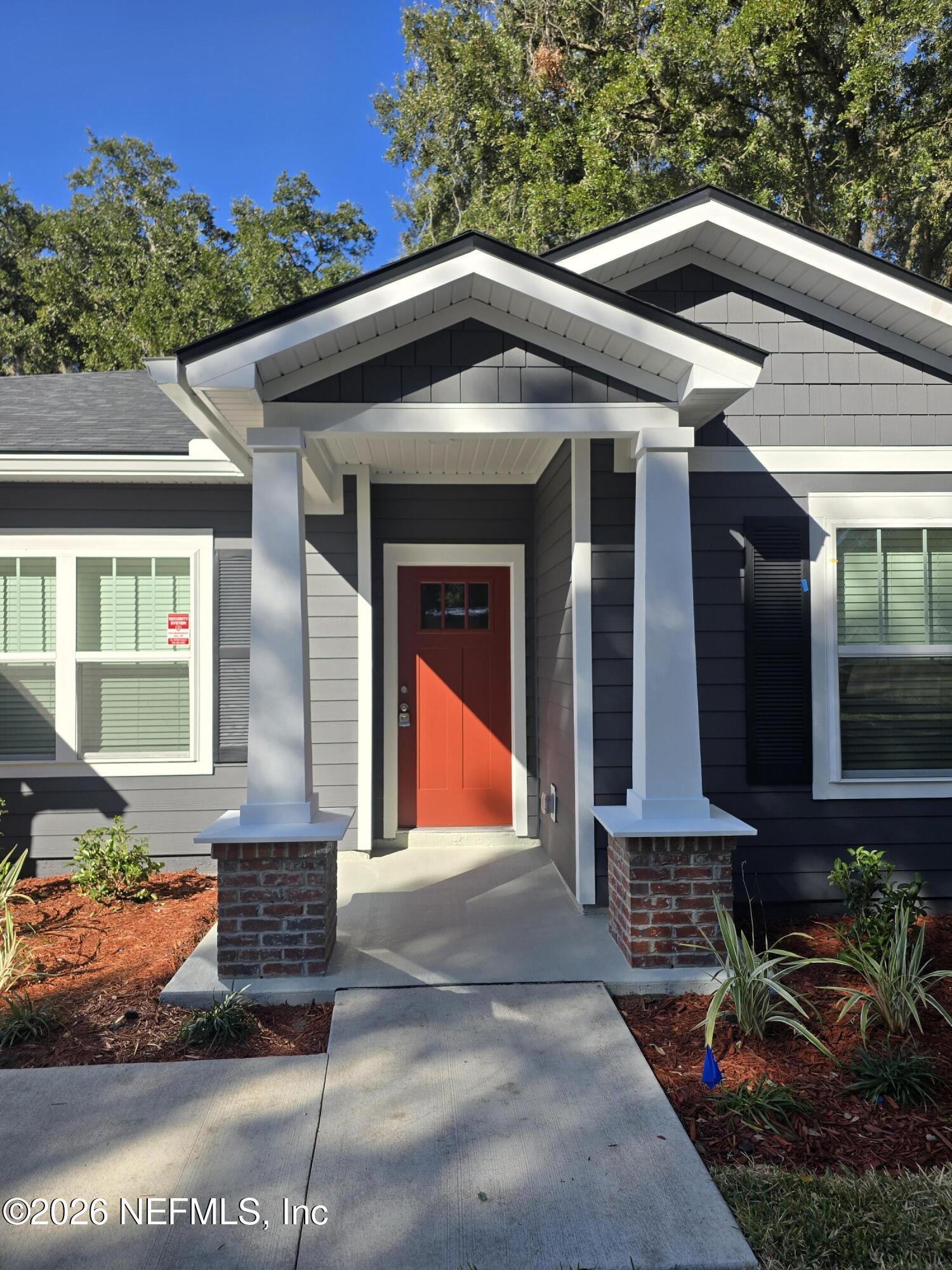 13748 Coman Road Jacksonville, FL 32218 - Photo 2 of 34 a front view of a house with porch