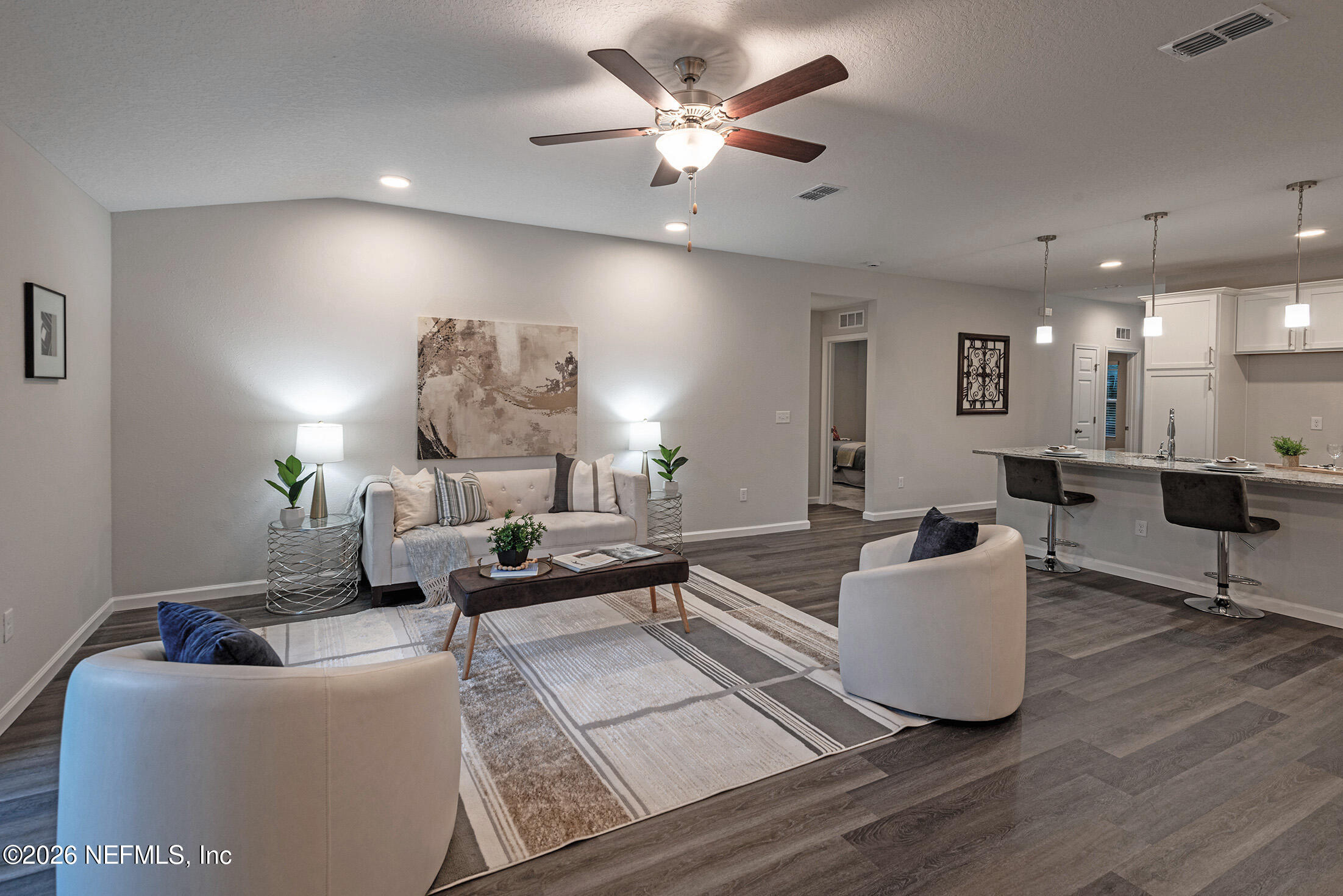 13748 Coman Road Jacksonville, FL 32218 - Photo 25 of 34 a living room with furniture and a chandelier