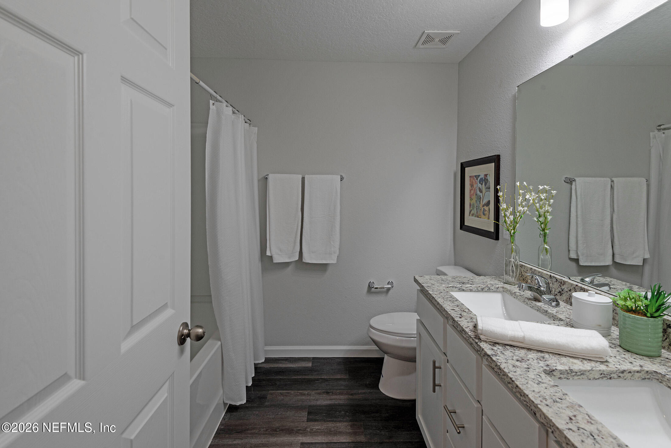 13748 Coman Road Jacksonville, FL 32218 - Photo 30 of 34 a bathroom with a granite countertop sink and a mirror
