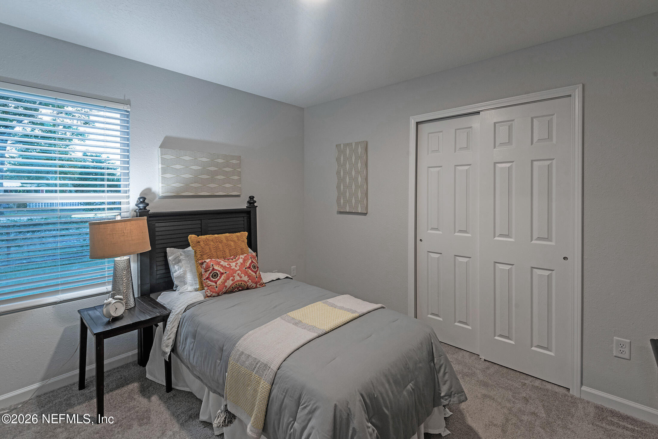 13748 Coman Road Jacksonville, FL 32218 - Photo 32 of 34 a bedroom with a bed and a window