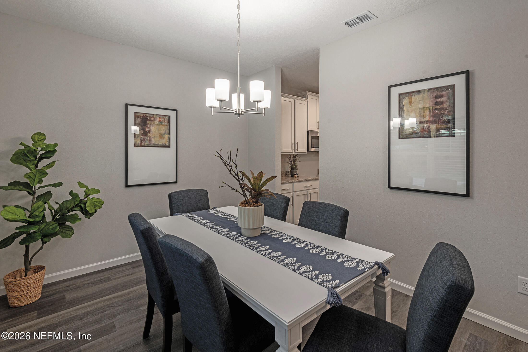 13748 Coman Road Jacksonville, FL 32218 - Photo 5 of 34 a view of a dining room with furniture and wooden floor