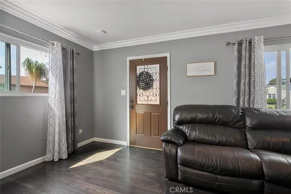 a living room with a couch and a window