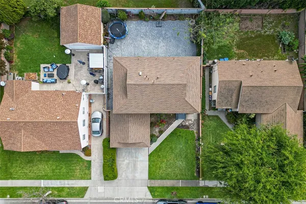 an aerial view of a house with a yard