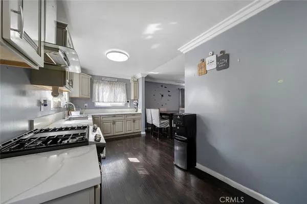 a kitchen with a stove and a refrigerator