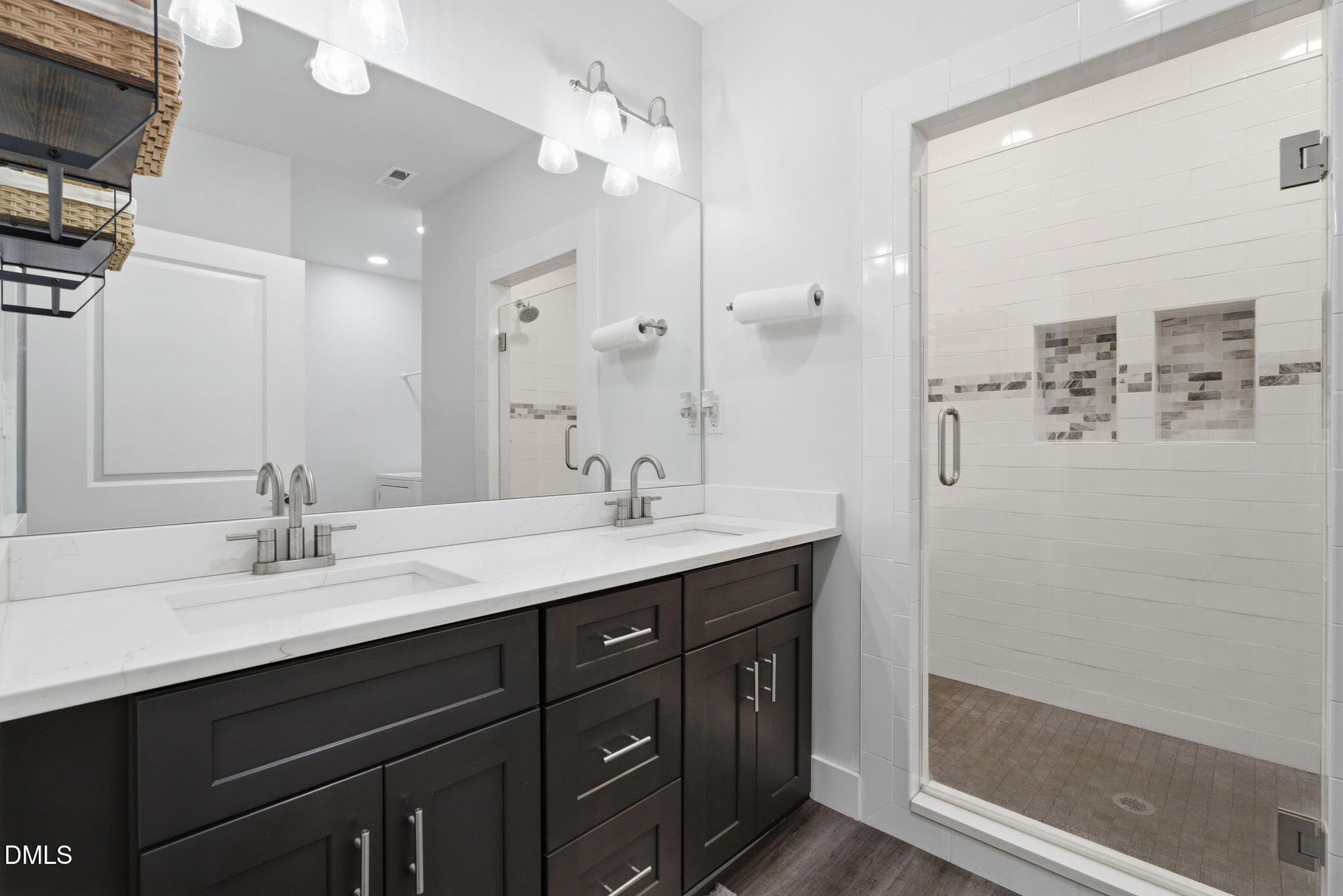 5416 Pulley Town Road Zebulon, NC 27597 - Photo 67 of 74 a bathroom with a double vanity sink a mirror and shower