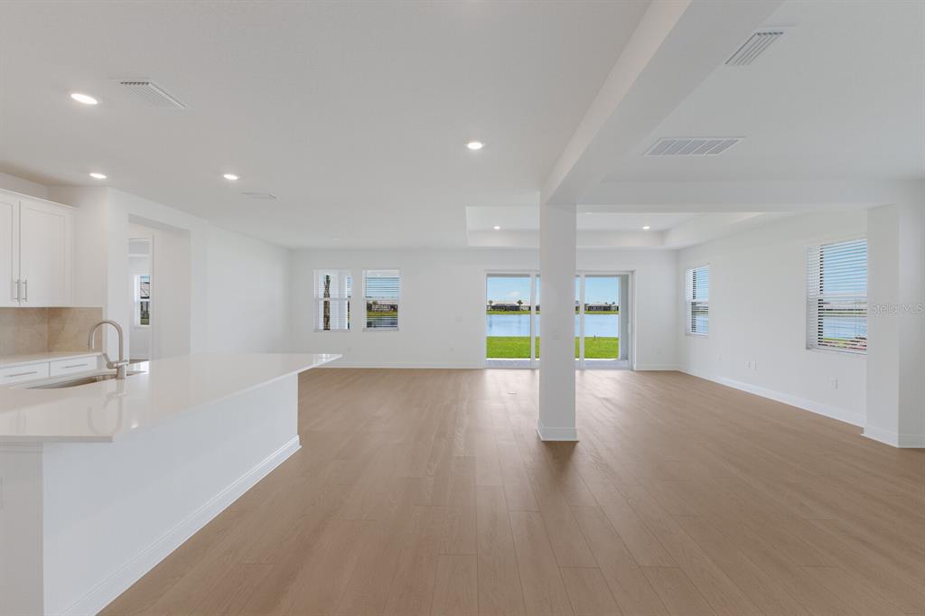4611 Sweet Retreat Run Lakewood Ranch, FL 34211 - Photo 9 of 37 a view of an empty room with window and wooden floor