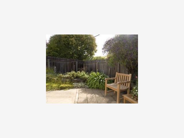 3194 Ross Road Palo Alto, CA 94303 - Photo 7 of 9 a balcony with chairs and a potted plant
