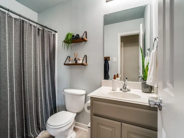 a bedroom with a bed and a chair