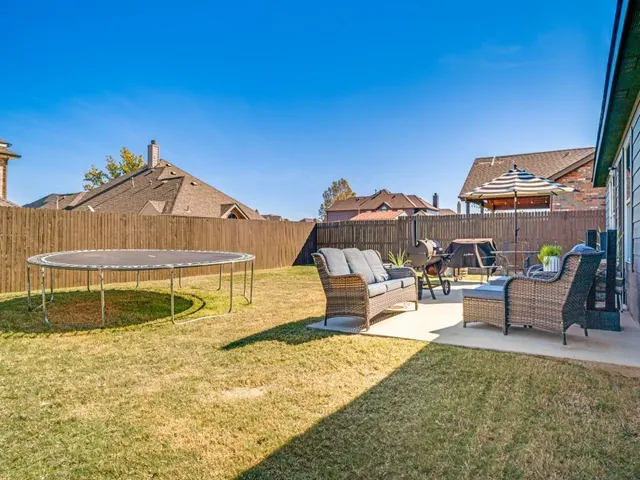 a outdoor living space with furniture and a potted plant