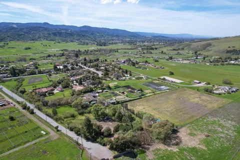 an aerial view of a city with mountains