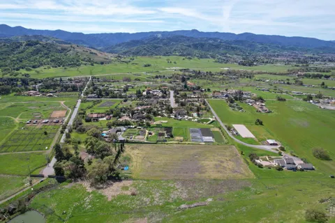 an aerial view of a town with couple of houses