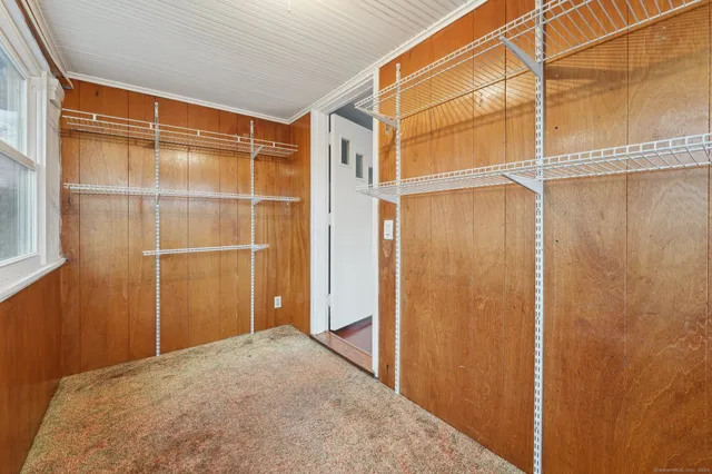 a view of a room with a glass door