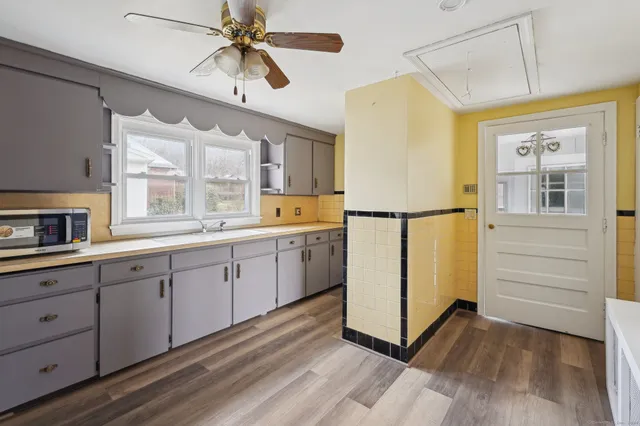 a kitchen with sink cabinets and window