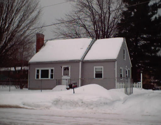 7 Blanding Street Springfield, MA 01151 - Photo 1 of 1 a view of a white house with a yard covered in snow