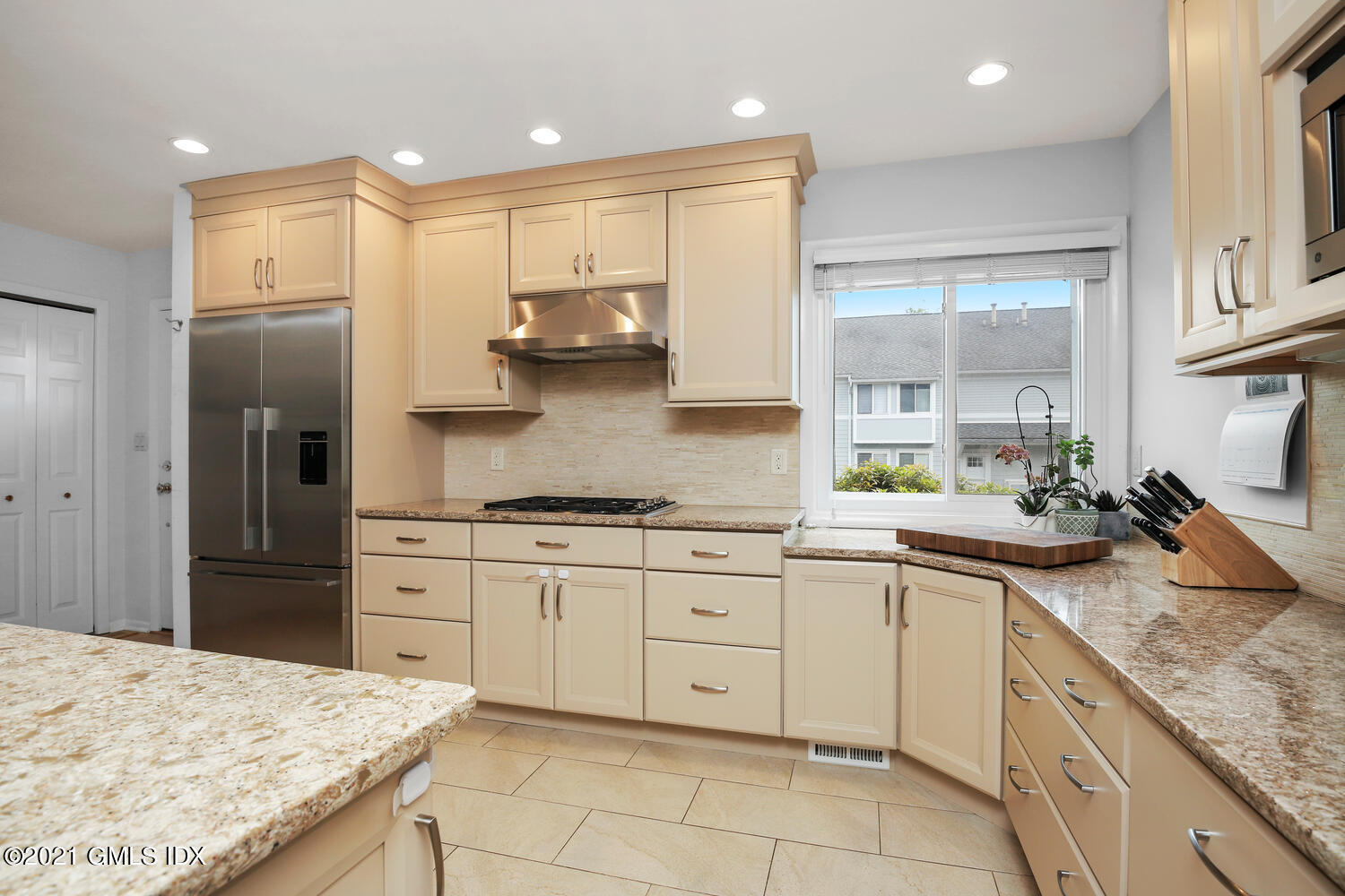 3 Whiffletree Way, Unit 3 Riverside, CT 06878 - Photo 4 of 24 a kitchen with stainless steel appliances granite countertop a sink and cabinets