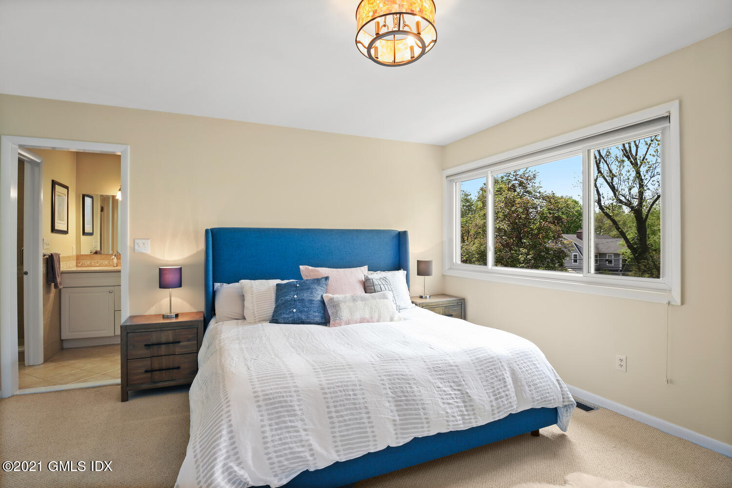 3 Whiffletree Way, Unit 3 Riverside, CT 06878 - Photo 9 of 24 a bedroom with a bed and a window