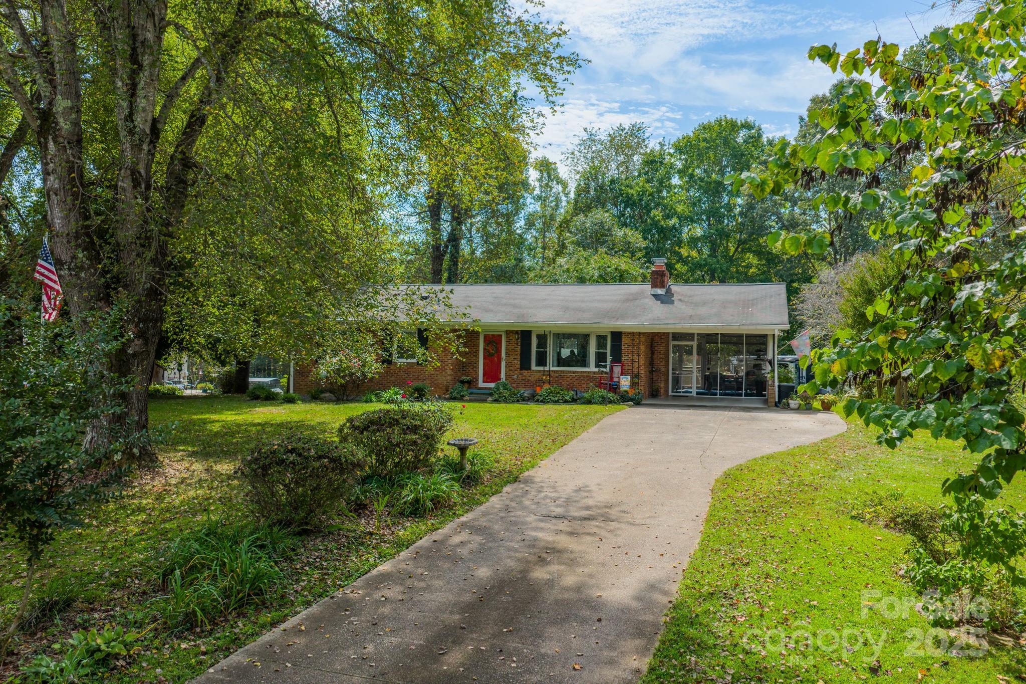 3651 Pea Ridge Road Morganton, NC 28655 - Photo 1 of 43 a front view of a house with yard and green space