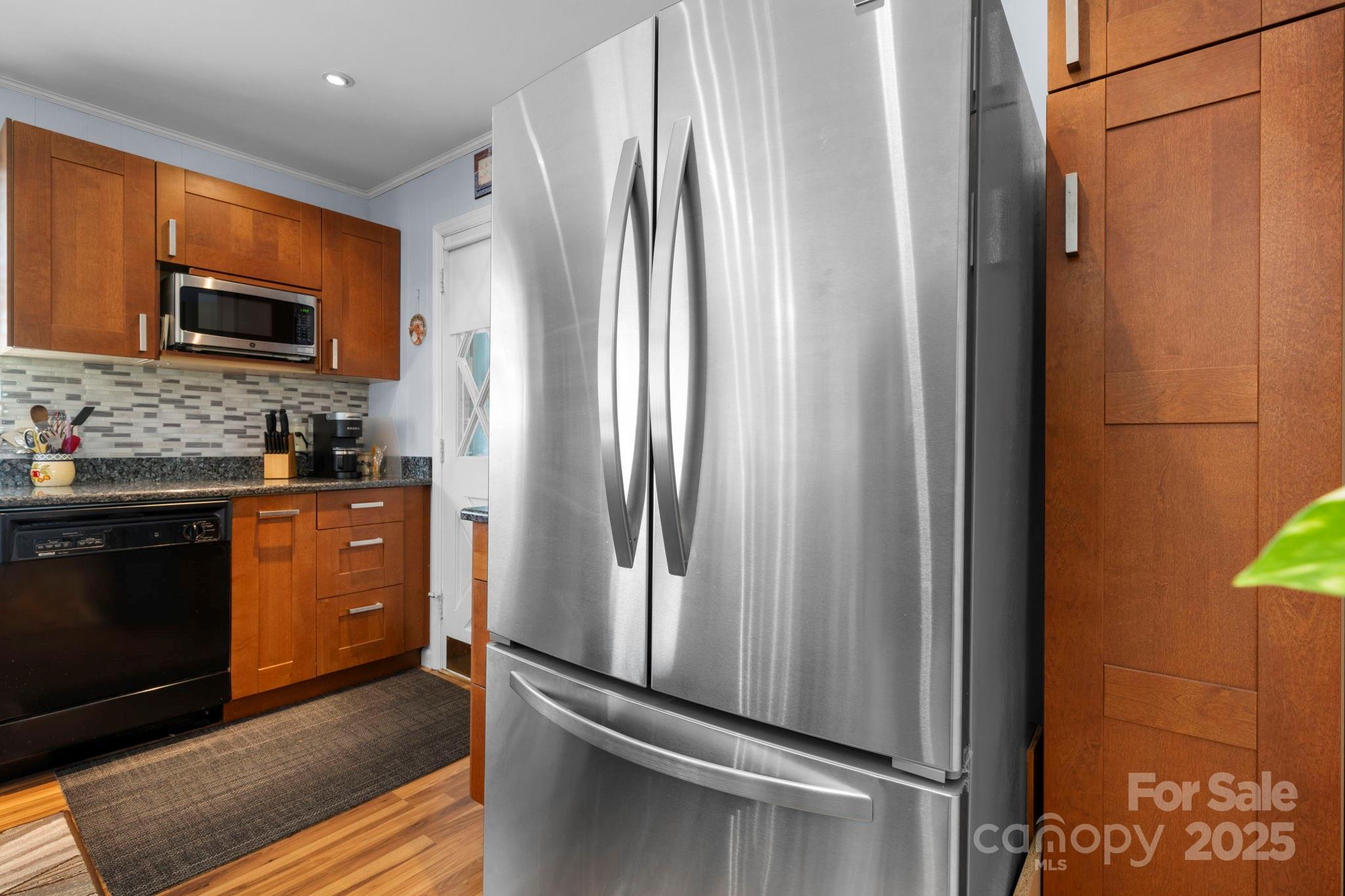 3651 Pea Ridge Road Morganton, NC 28655 - Photo 18 of 43 a kitchen with stainless steel appliances a refrigerator and a stove top oven