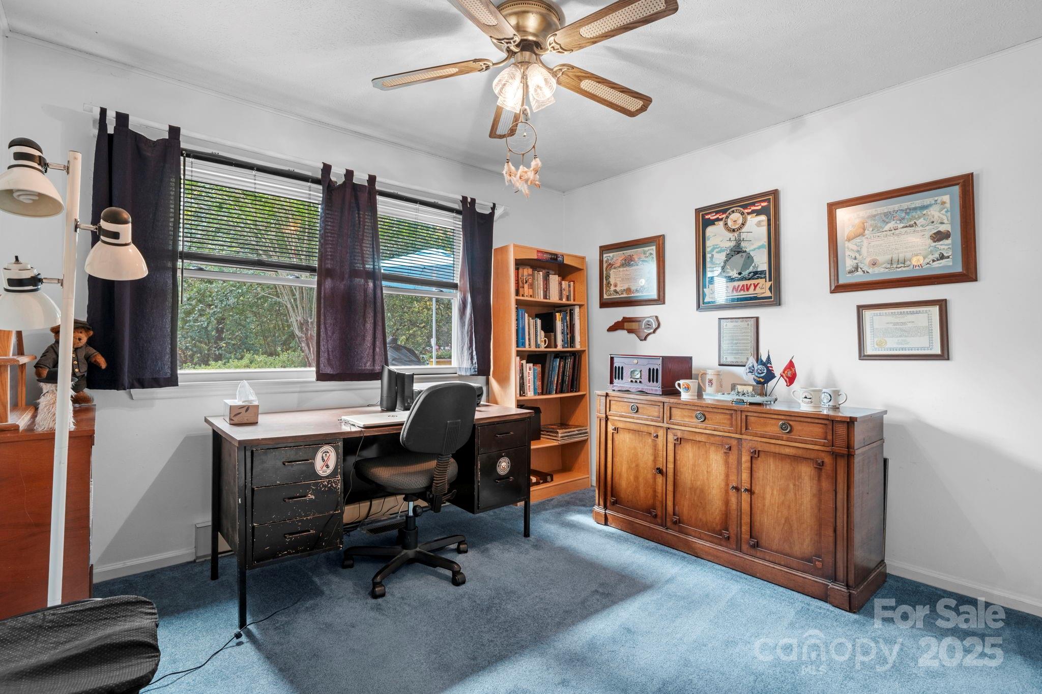 3651 Pea Ridge Road Morganton, NC 28655 - Photo 23 of 43 a view of a workspace with furniture and a window
