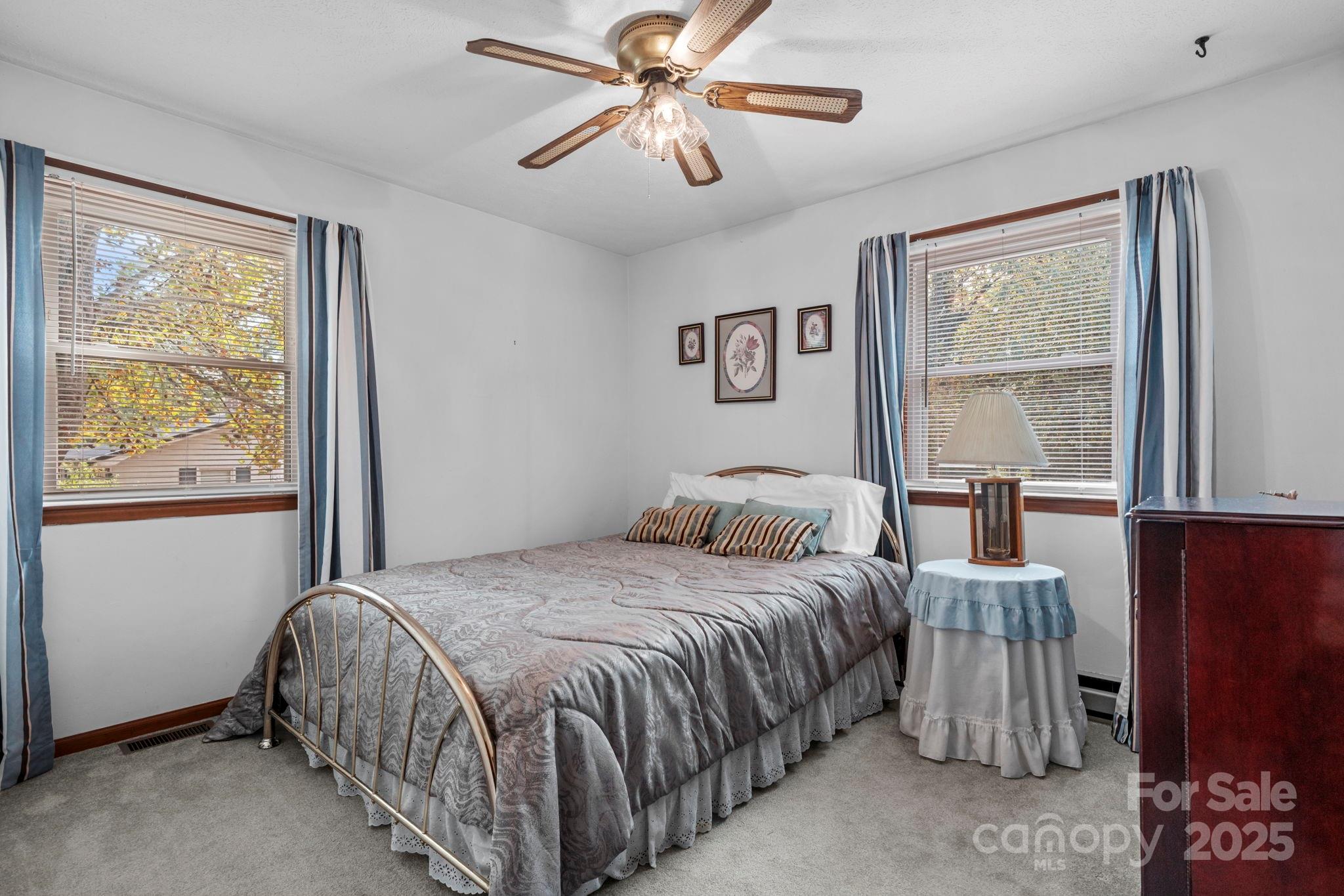 3651 Pea Ridge Road Morganton, NC 28655 - Photo 24 of 43 a bedroom with a bed and a window