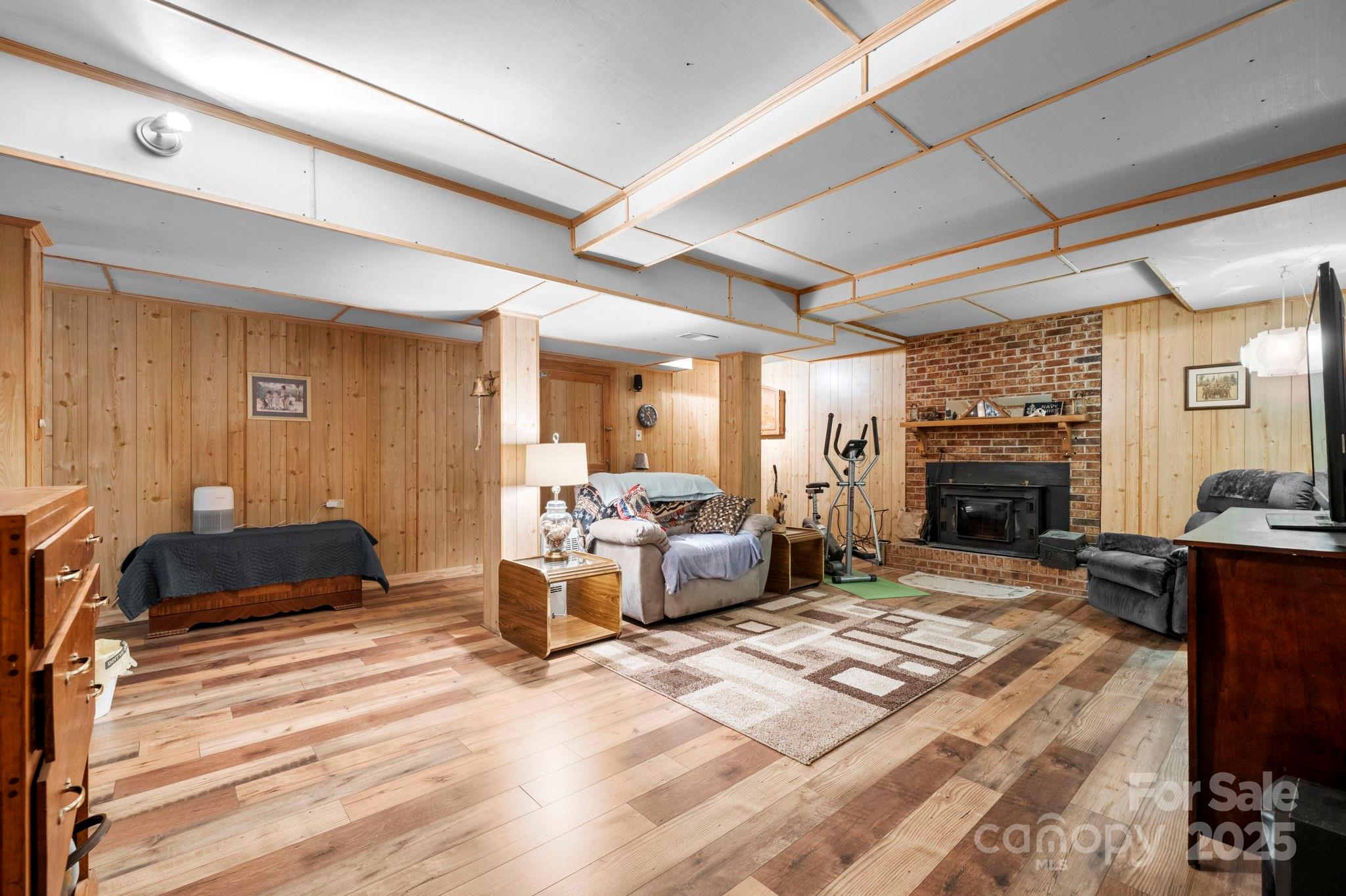 3651 Pea Ridge Road Morganton, NC 28655 - Photo 27 of 43 a living room with furniture large window and a fireplace