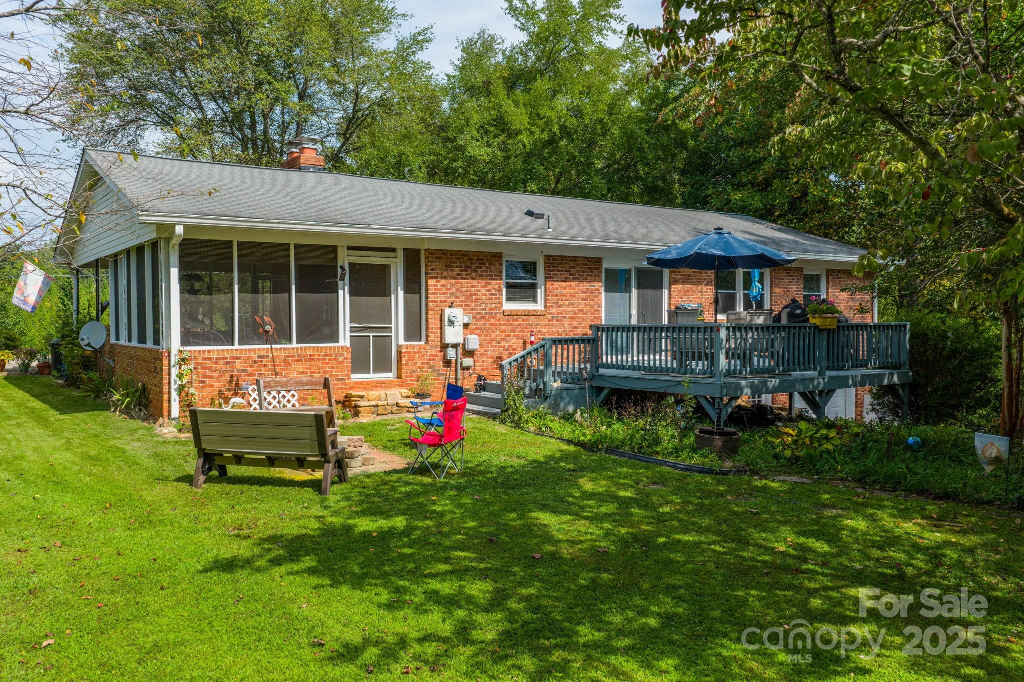 3651 Pea Ridge Road Morganton, NC 28655 - Photo 30 of 43 a backyard of a house with wooden deck and furniture