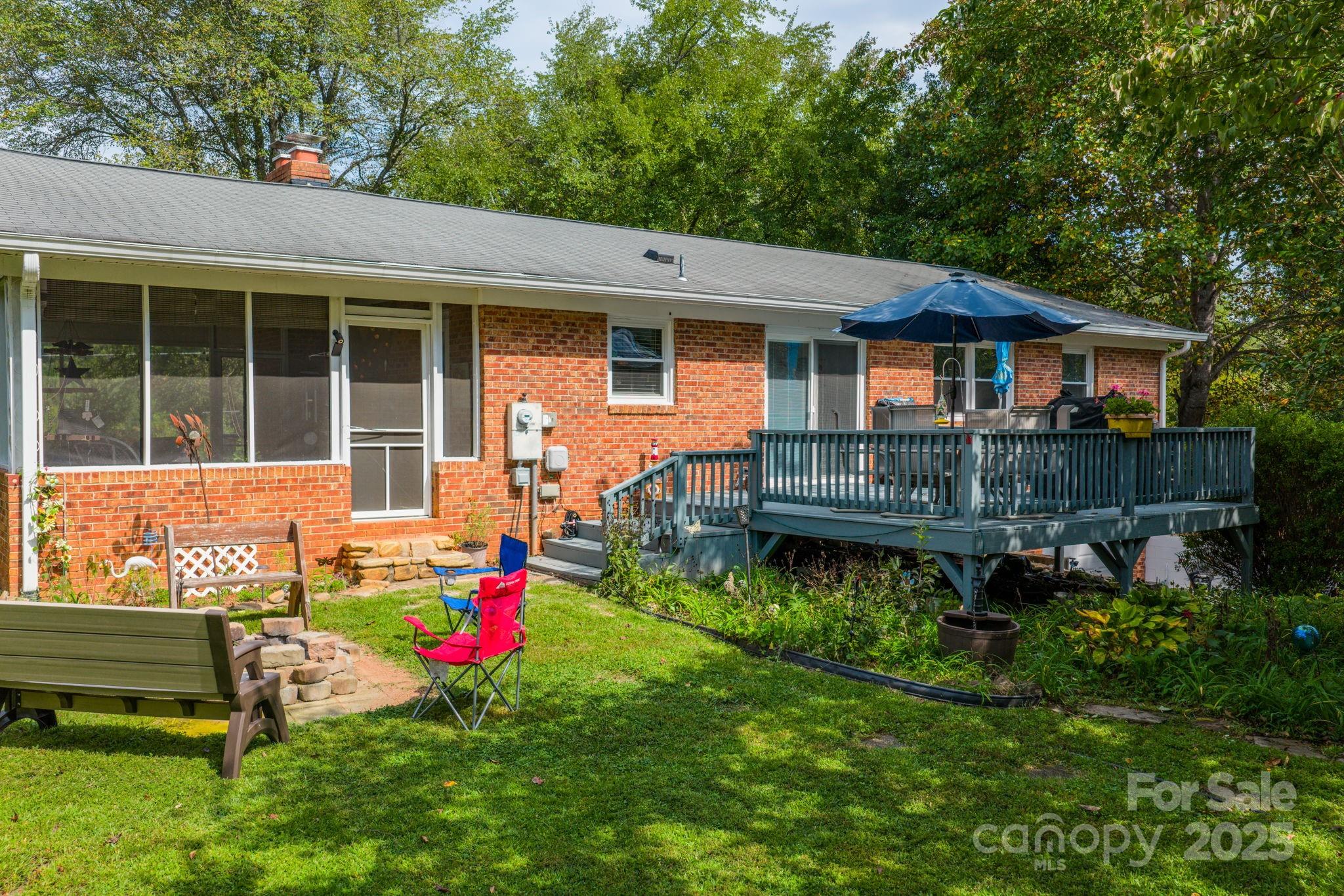 3651 Pea Ridge Road Morganton, NC 28655 - Photo 31 of 43 a view of backyard with deck and garden