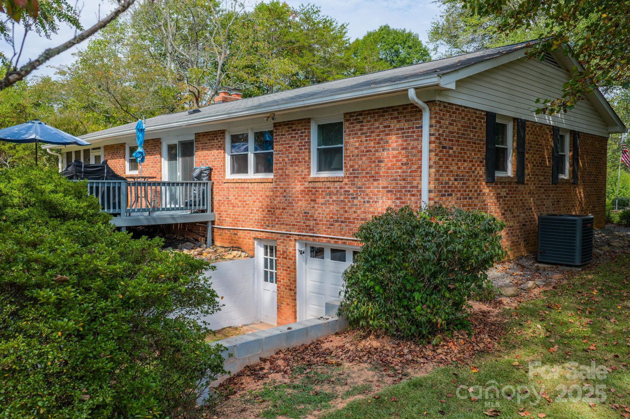 3651 Pea Ridge Road Morganton, NC 28655 - Photo 34 of 43 a front view of a house with a garden
