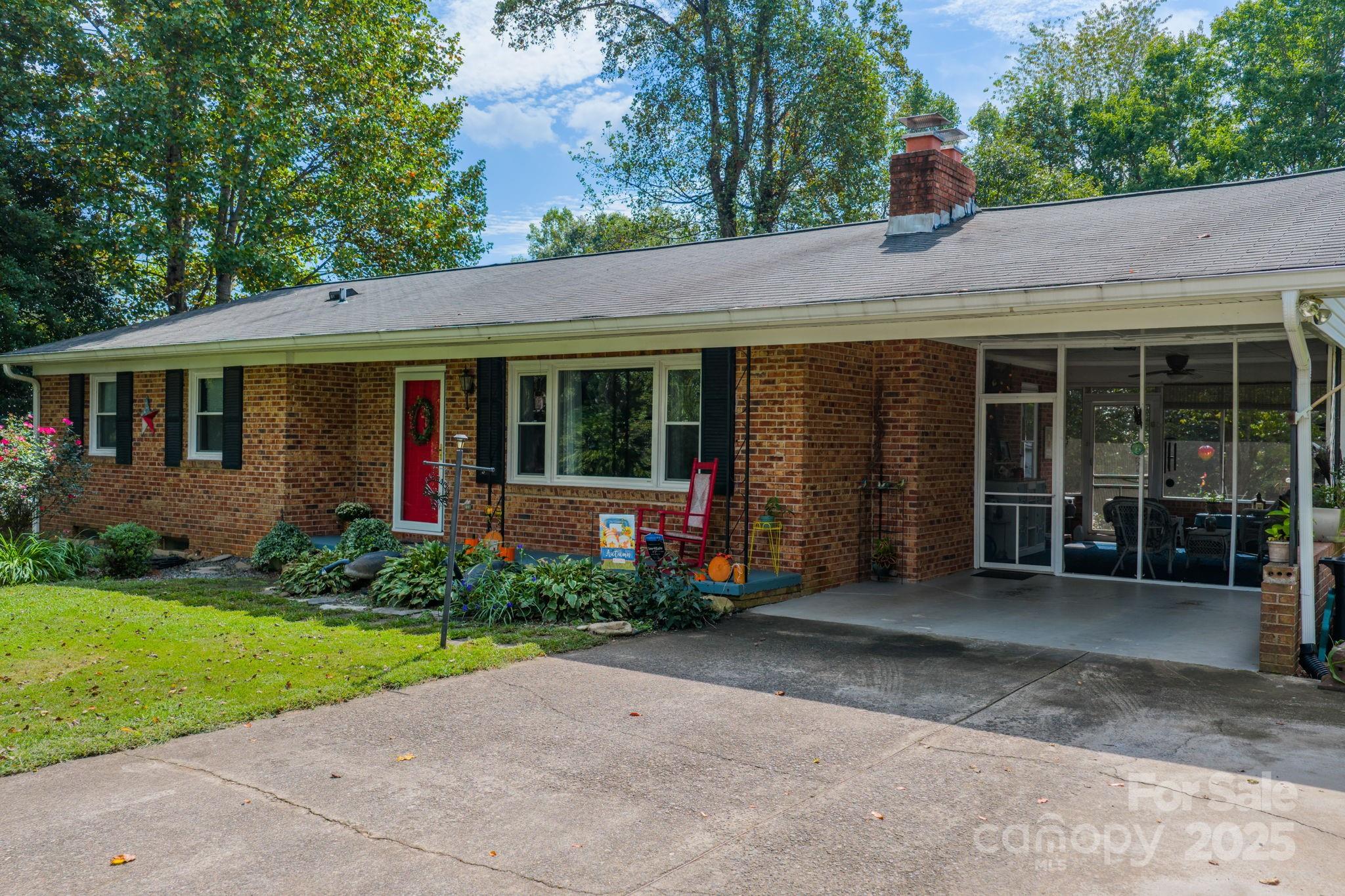 3651 Pea Ridge Road Morganton, NC 28655 - Photo 6 of 43 a view of a house with garden and yard