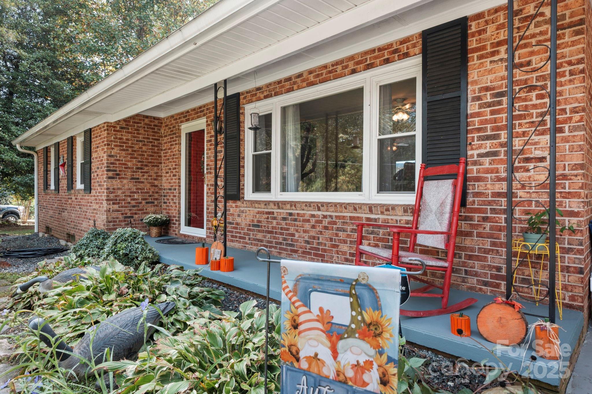 3651 Pea Ridge Road Morganton, NC 28655 - Photo 7 of 43 front view of a house with a chairs and table in a patio