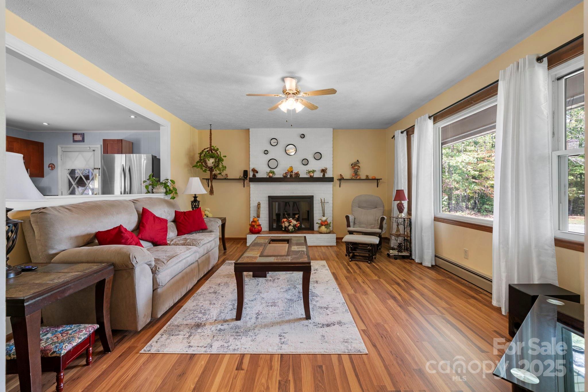 3651 Pea Ridge Road Morganton, NC 28655 - Photo 9 of 43 a living room with furniture and a fireplace
