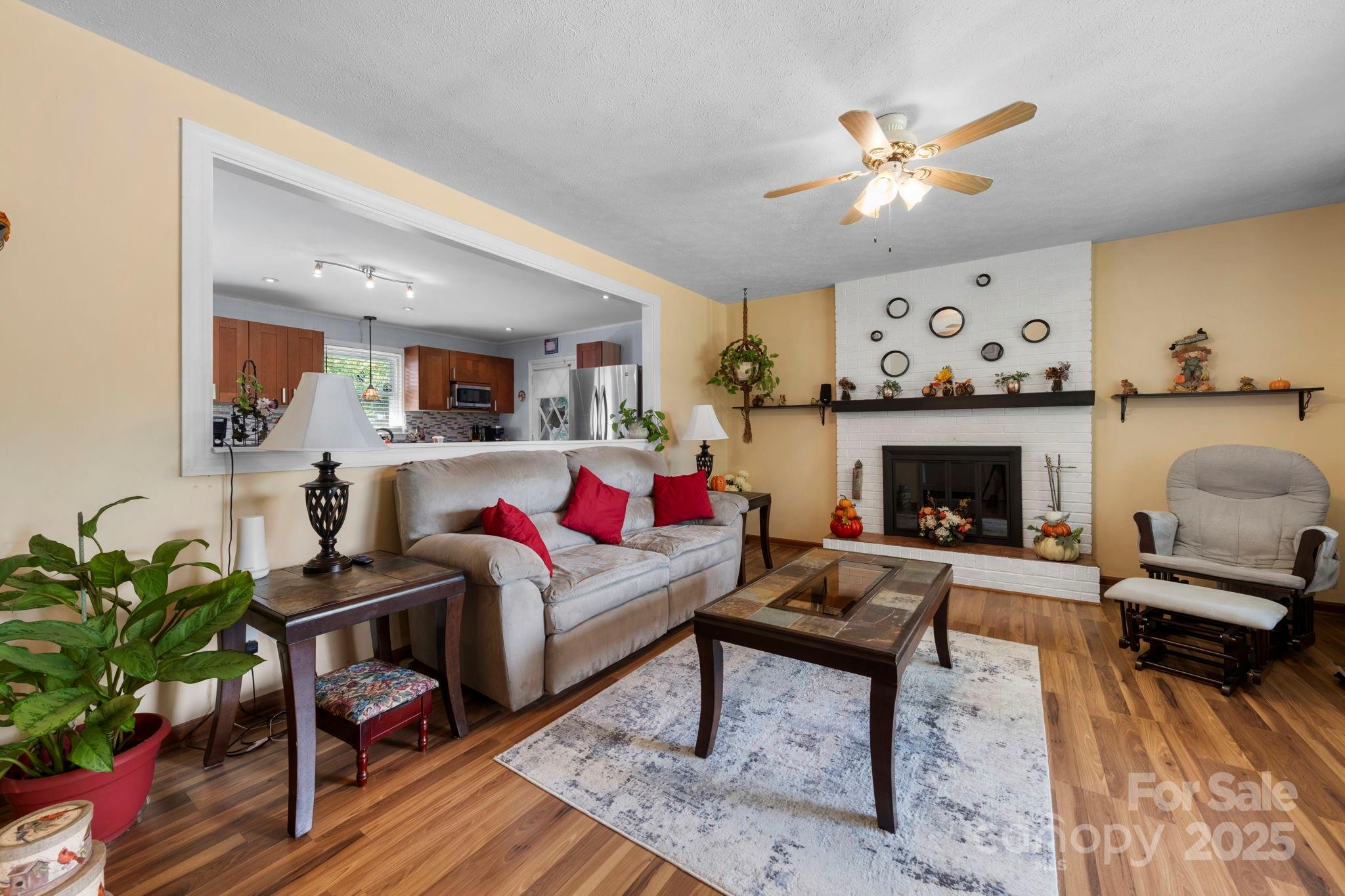 3651 Pea Ridge Road Morganton, NC 28655 - Photo 10 of 43 a living room with furniture and a fireplace