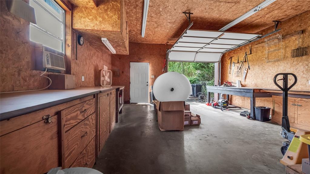 193 Eisenhower Road Denison, TX 75020 - Photo 28 of 30 Garage with cooling unit