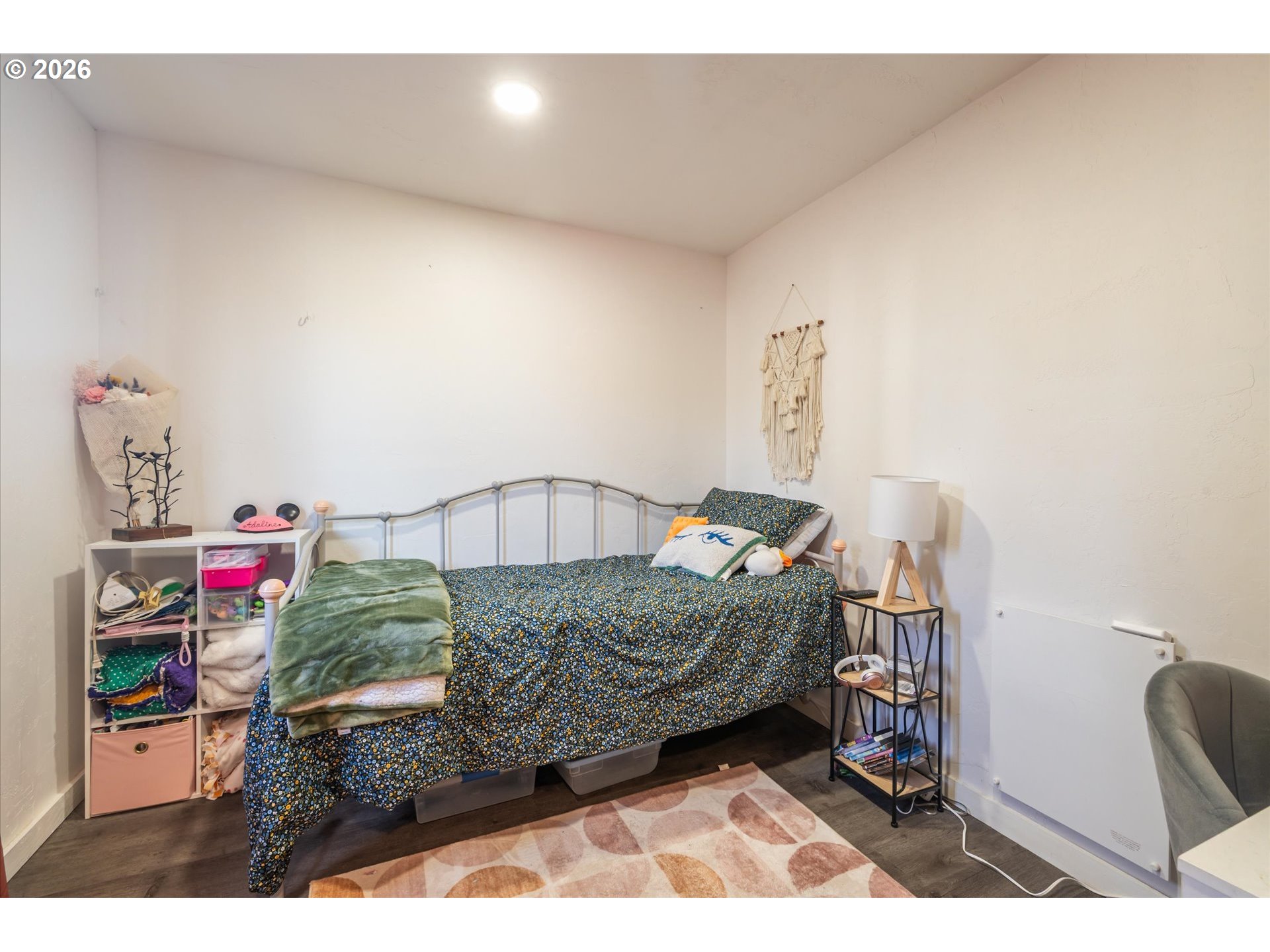 1789 14th Street North Bend, OR 97459 - Photo 22 of 43 a bedroom with furniture and a wooden floor
