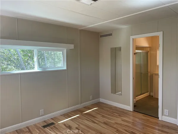 a bathroom with a glass shower door