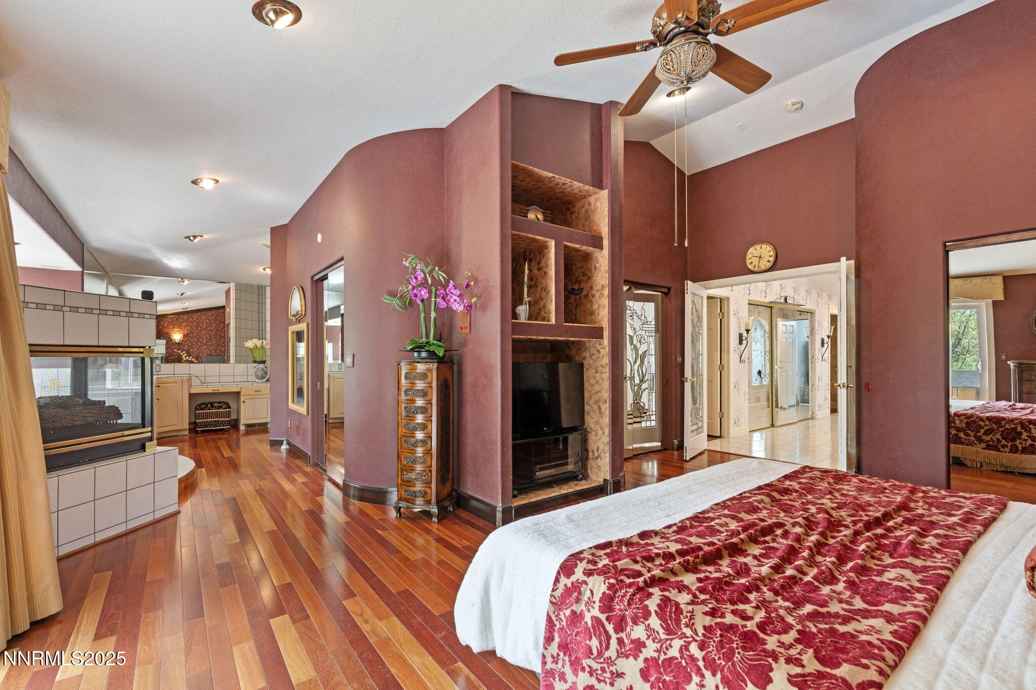 5195 Canyon Drive Reno, NV 89519 - Photo 30 of 69 a bed room with a bed and a chandelier