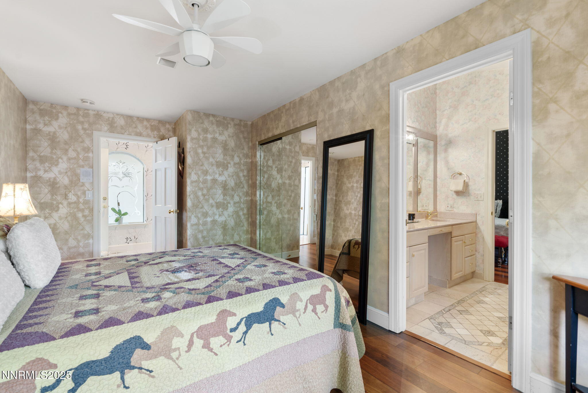 5195 Canyon Drive Reno, NV 89519 - Photo 35 of 69 a bedroom with a large bed and a chandelier