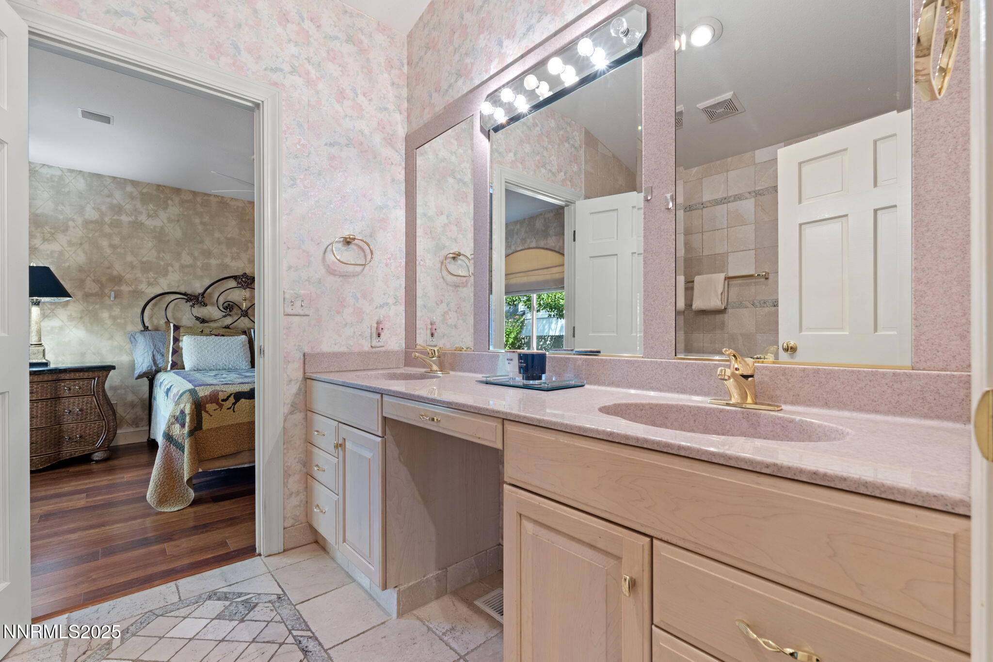 5195 Canyon Drive Reno, NV 89519 - Photo 36 of 69 a bathroom with a sink and a mirror