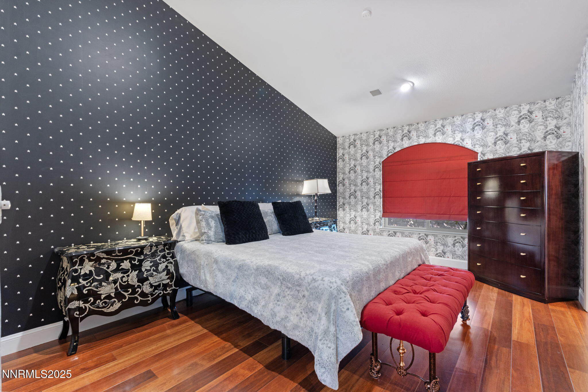 5195 Canyon Drive Reno, NV 89519 - Photo 37 of 69 a bedroom with a bed and dresser with mirror