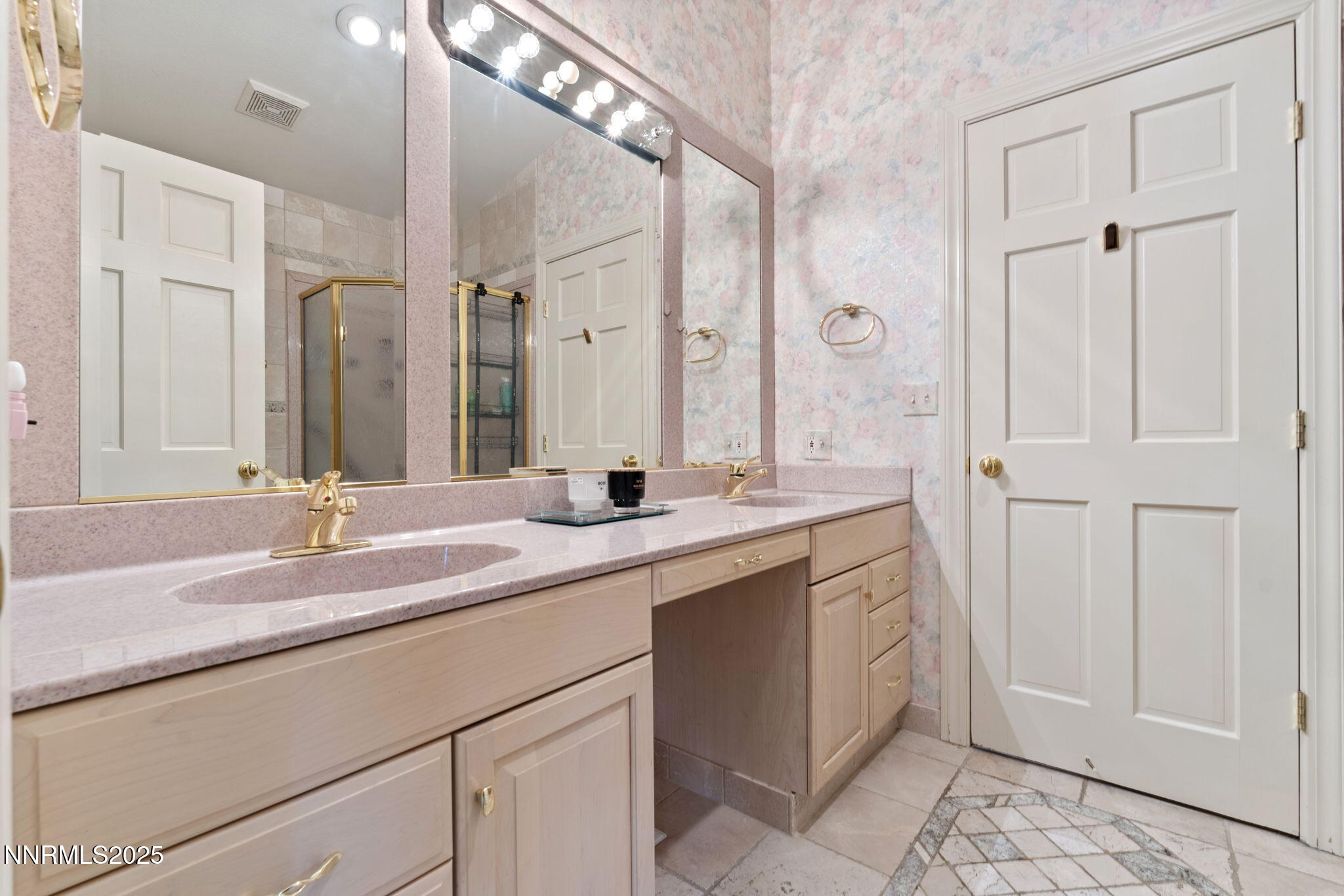 5195 Canyon Drive Reno, NV 89519 - Photo 39 of 69 a bathroom with a granite countertop sink a mirror and a