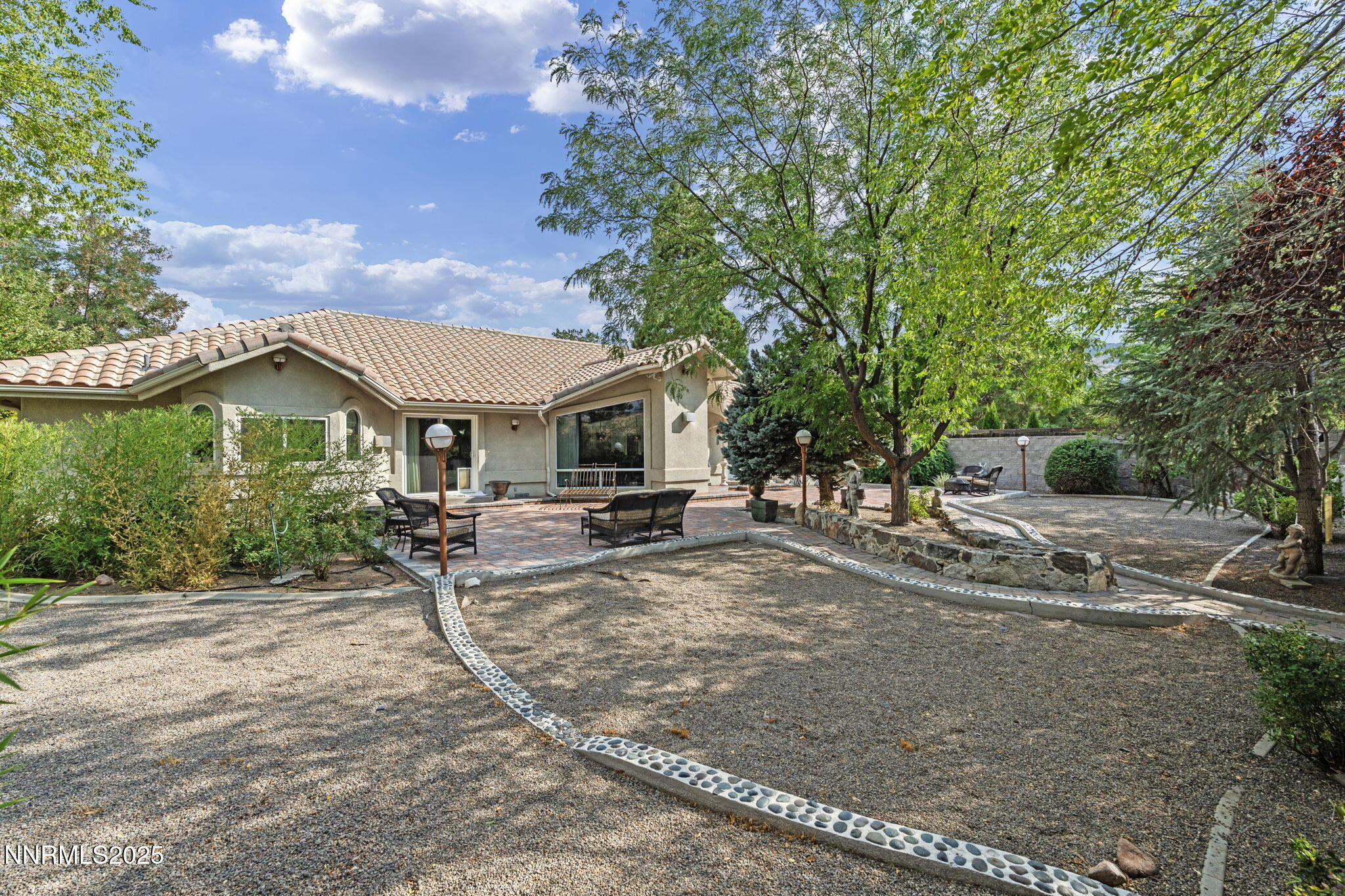 5195 Canyon Drive Reno, NV 89519 - Photo 5 of 69 a view of a house with backyard and sitting area