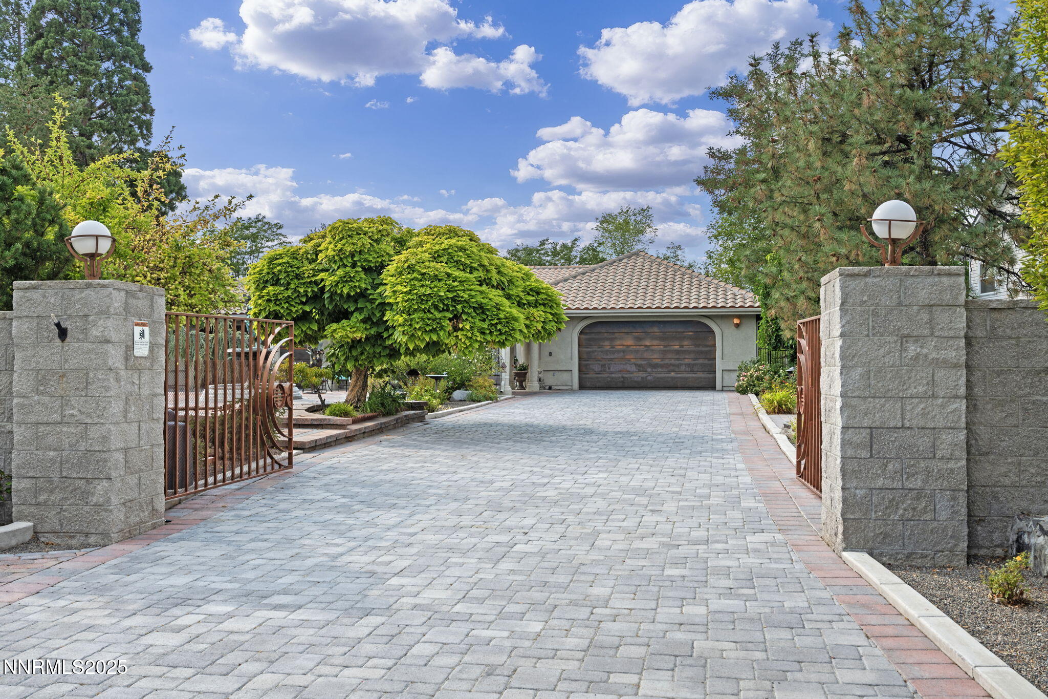 5195 Canyon Drive Reno, NV 89519 - Photo 55 of 69 a front view of a house with a yard and garage