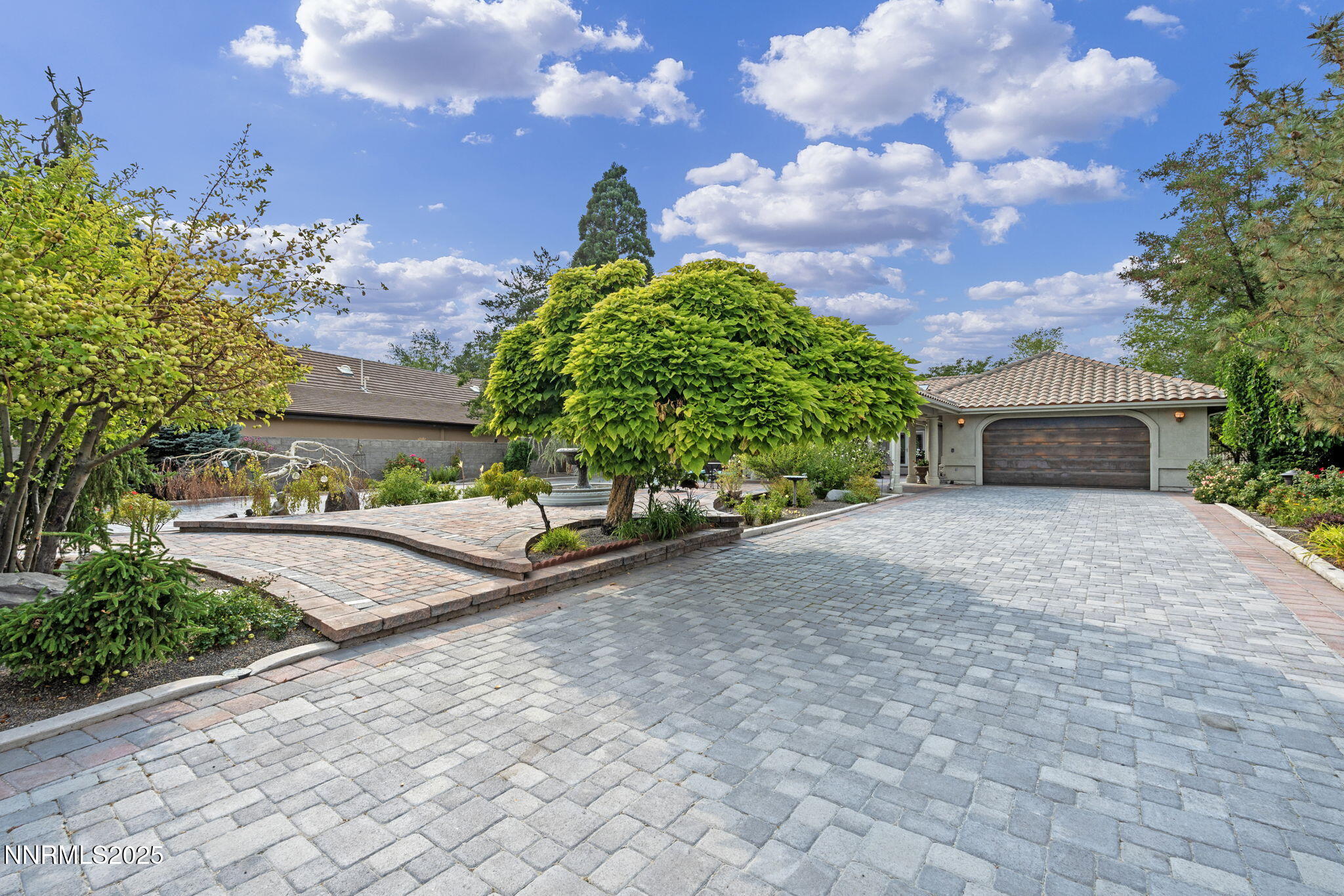 5195 Canyon Drive Reno, NV 89519 - Photo 58 of 69 a front view of a house with a yard and trees