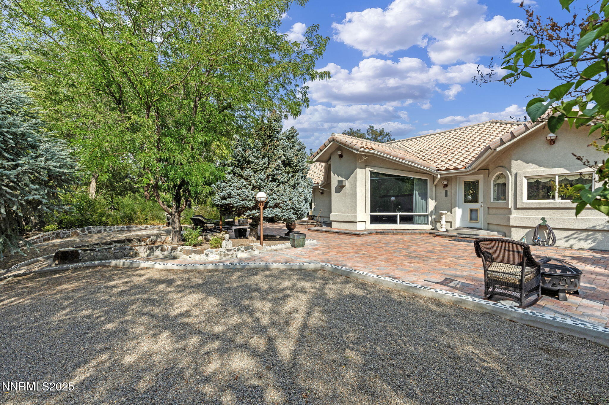 5195 Canyon Drive Reno, NV 89519 - Photo 65 of 69 a backyard of a house with table and chairs