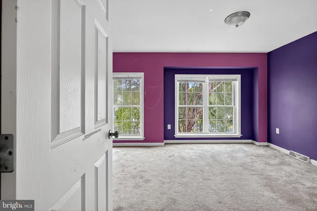 a view of an empty room with window