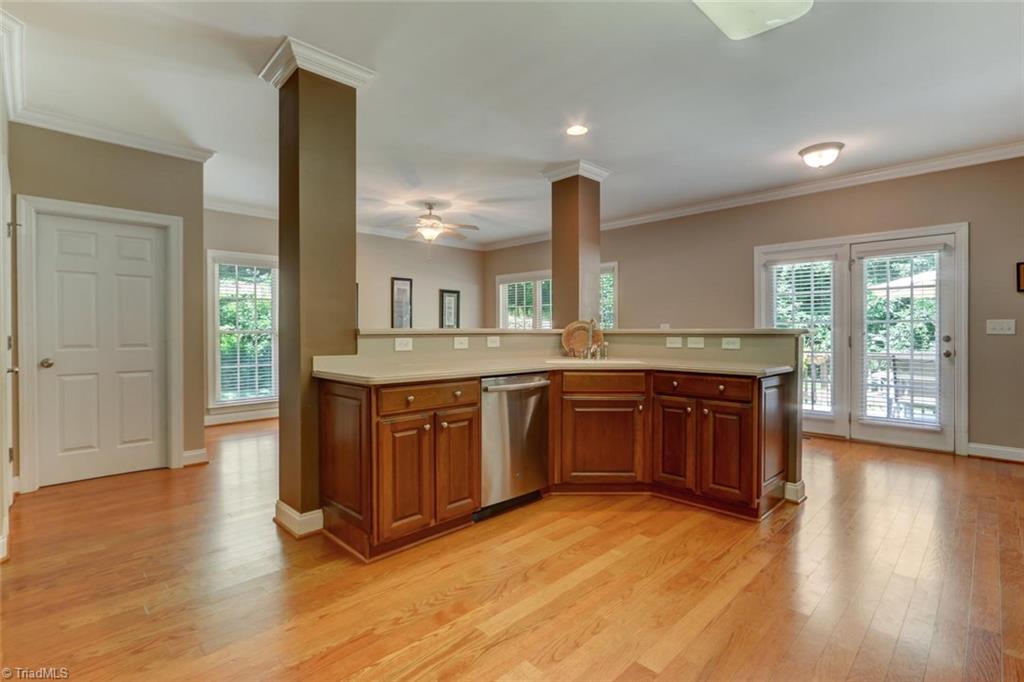 605 Stafford Pointe Court Oak Ridge, NC 27310 - Photo 11 of 30 The stand-up/sit-up bar area is great for giving your family or guests a place to gather while you are preparing the meal