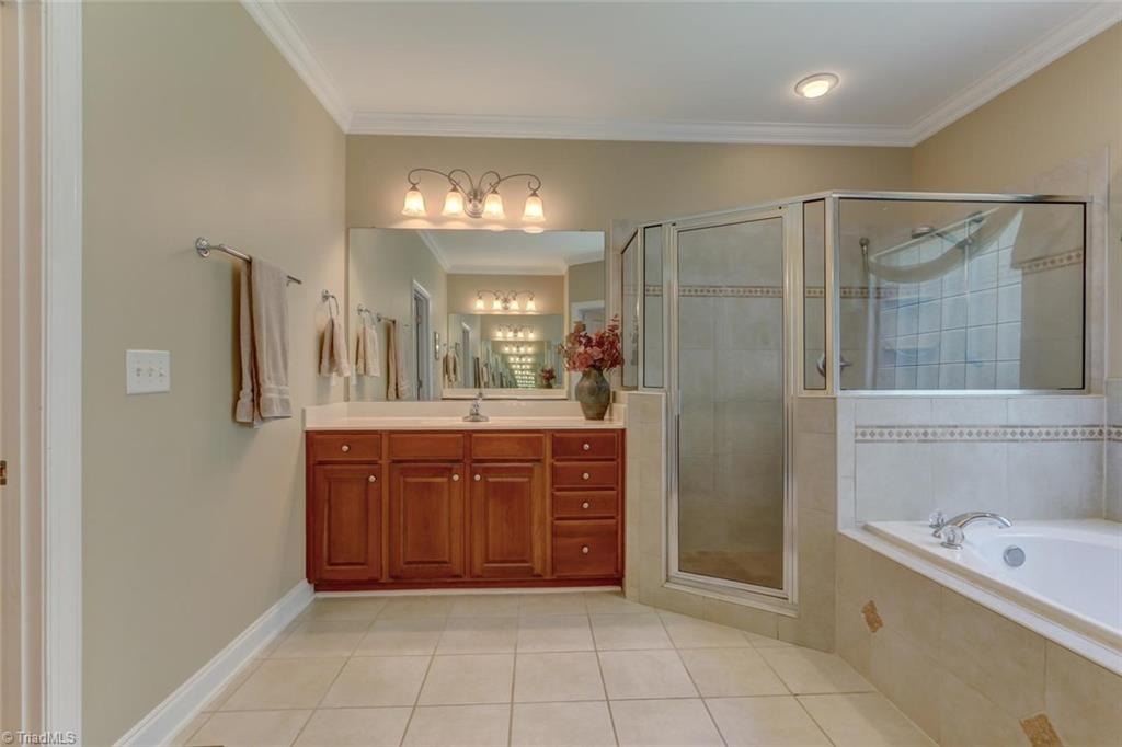 605 Stafford Pointe Court Oak Ridge, NC 27310 - Photo 19 of 30 Another look at the soaking tub and large tiled shower
