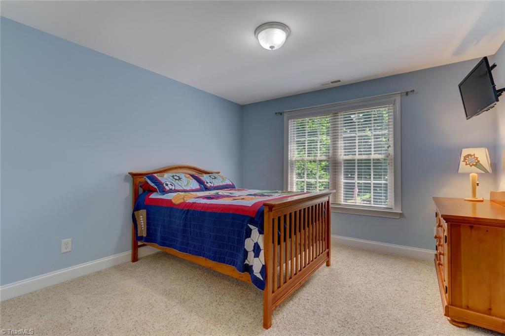 605 Stafford Pointe Court Oak Ridge, NC 27310 - Photo 20 of 30 One of three possible upstairs bedrooms with ample room