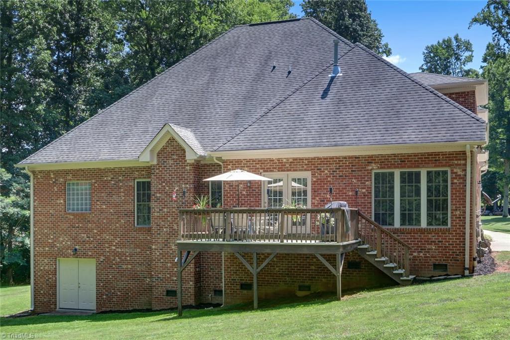 605 Stafford Pointe Court Oak Ridge, NC 27310 - Photo 27 of 30 Notice the lower door to an unfinished basement where you can store your toys or use it as a workout area as the current owners did